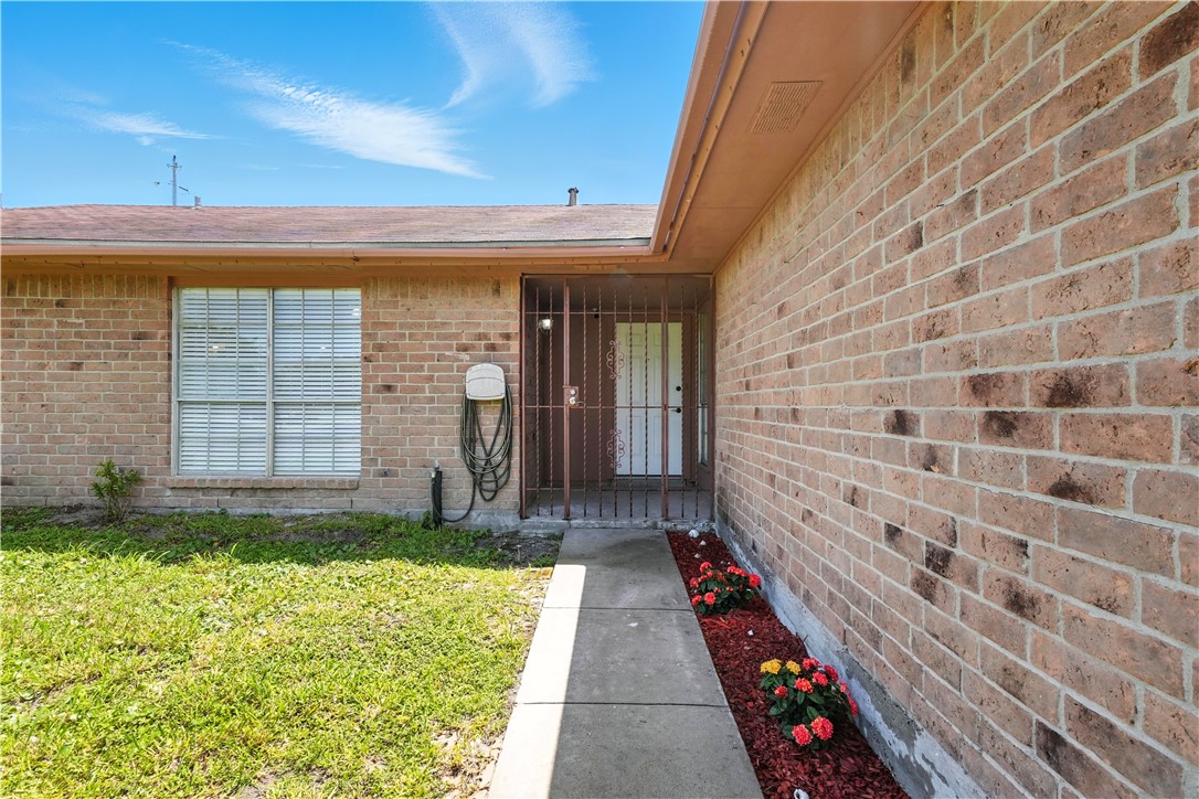 833 Orleans Drive Corpus Christi, TX 78418 - Photo 18 of 18 a view of front door of house with yard