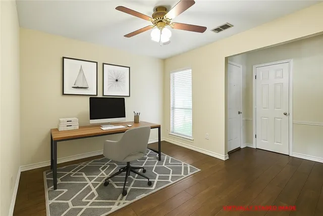 a workspace with furniture and wooden floor