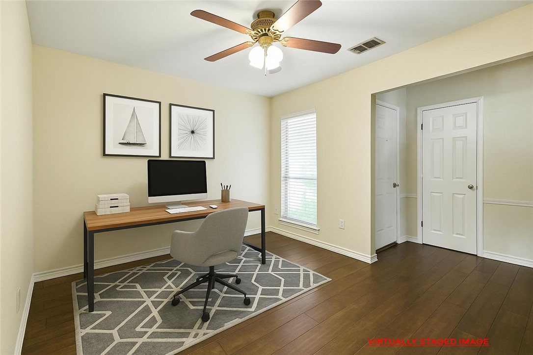 833 Orleans Drive Corpus Christi, TX 78418 - Photo 5 of 18 a workspace with furniture and wooden floor