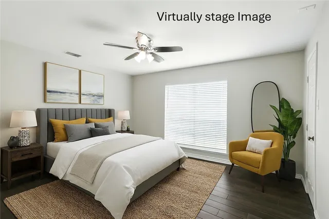 a bedroom with bed and window