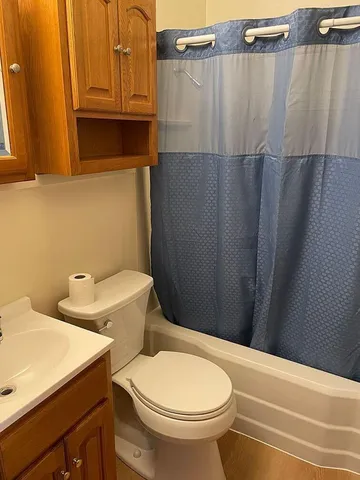 a bathroom with a toilet and a sink