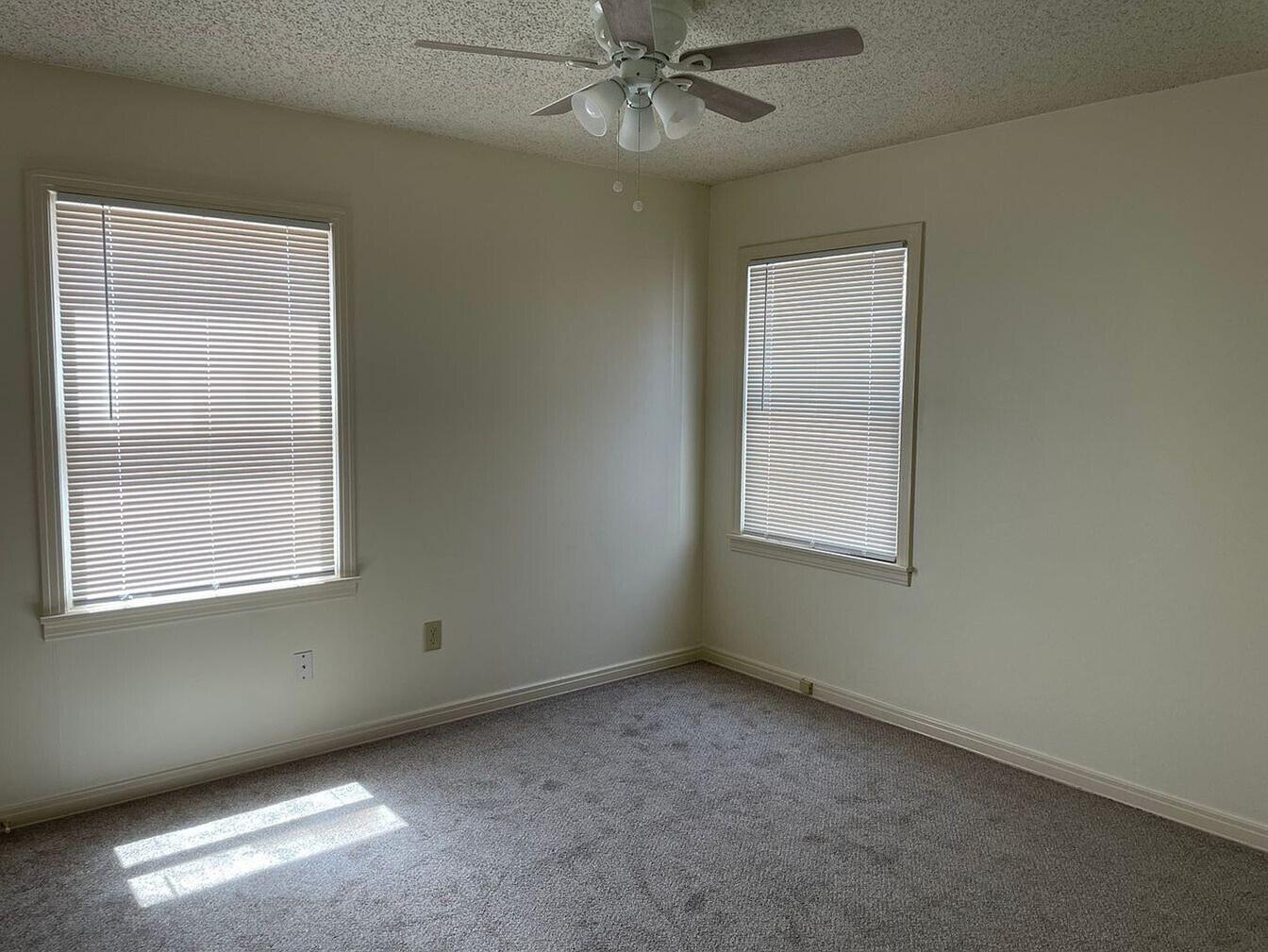 1301 41st Street Lubbock, TX 79412 - Photo 7 of 8 an empty room with a window