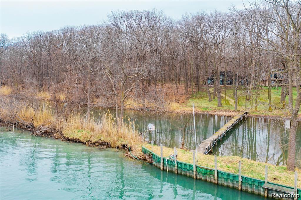 19130 Meridian Road Grosse Ile, MI 48138 - Photo 49 of 49 Keep your boat docked on the 110 ft long sea wall.