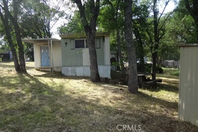 a view of a backyard of the house