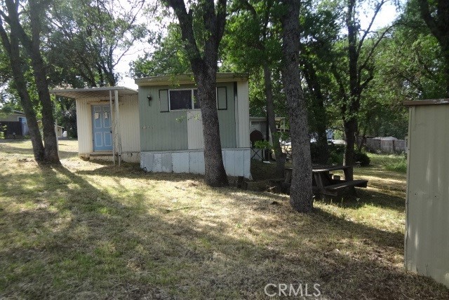 9216 Pebble Road Lower Lake, CA 95457 - Photo 12 of 14 a view of a house with backyard and sitting area