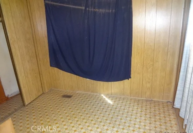 a bathroom with a granite countertop sink and a toilet