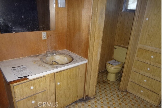 9216 Pebble Road Lower Lake, CA 95457 - Photo 5 of 14 a bathroom with a granite countertop sink and a toilet
