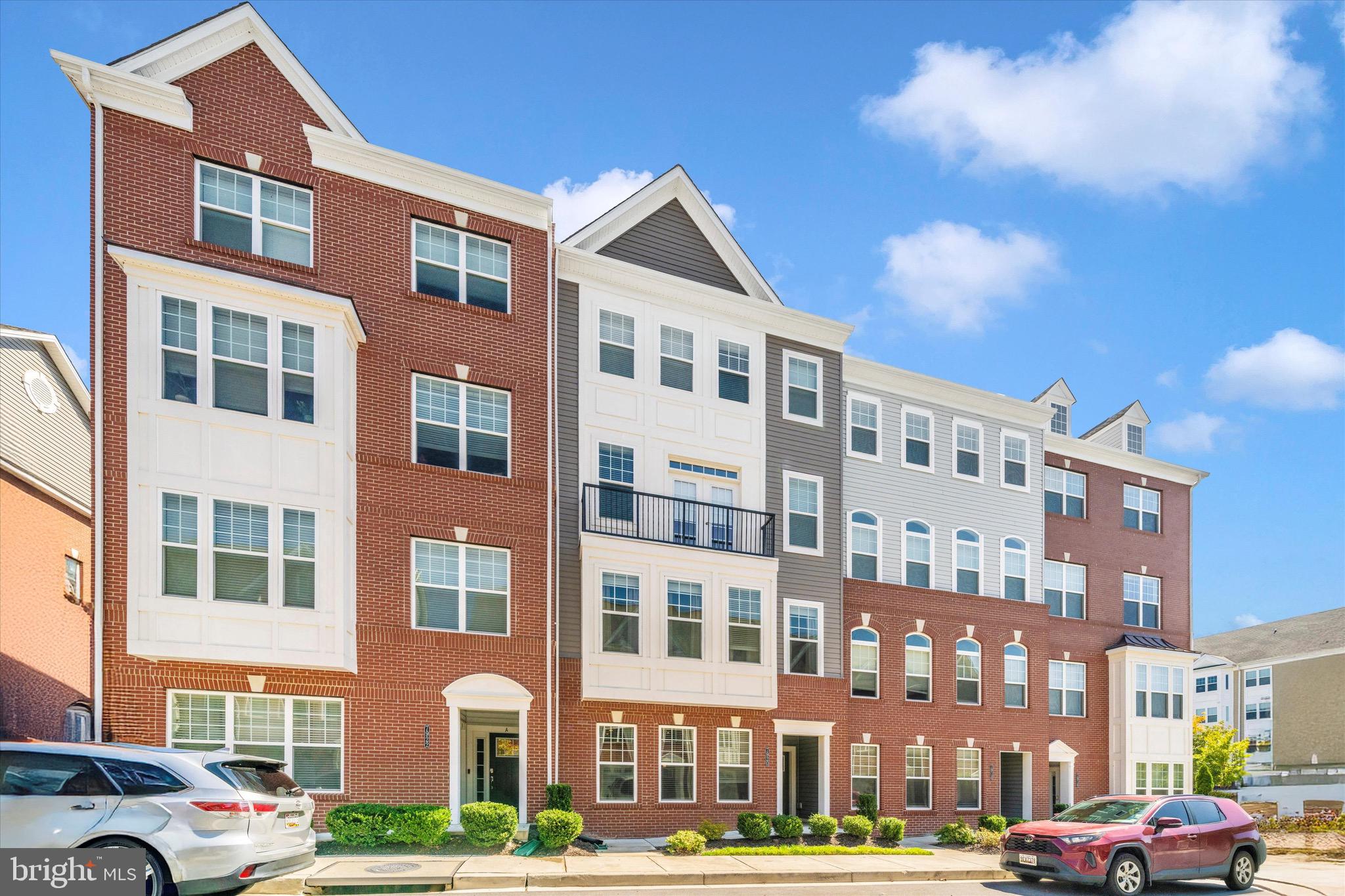 7920 Potter Place, Unit 920B Elkridge, MD 21075 - Photo 1 of 57 a front view of a building with lot of cars and trees