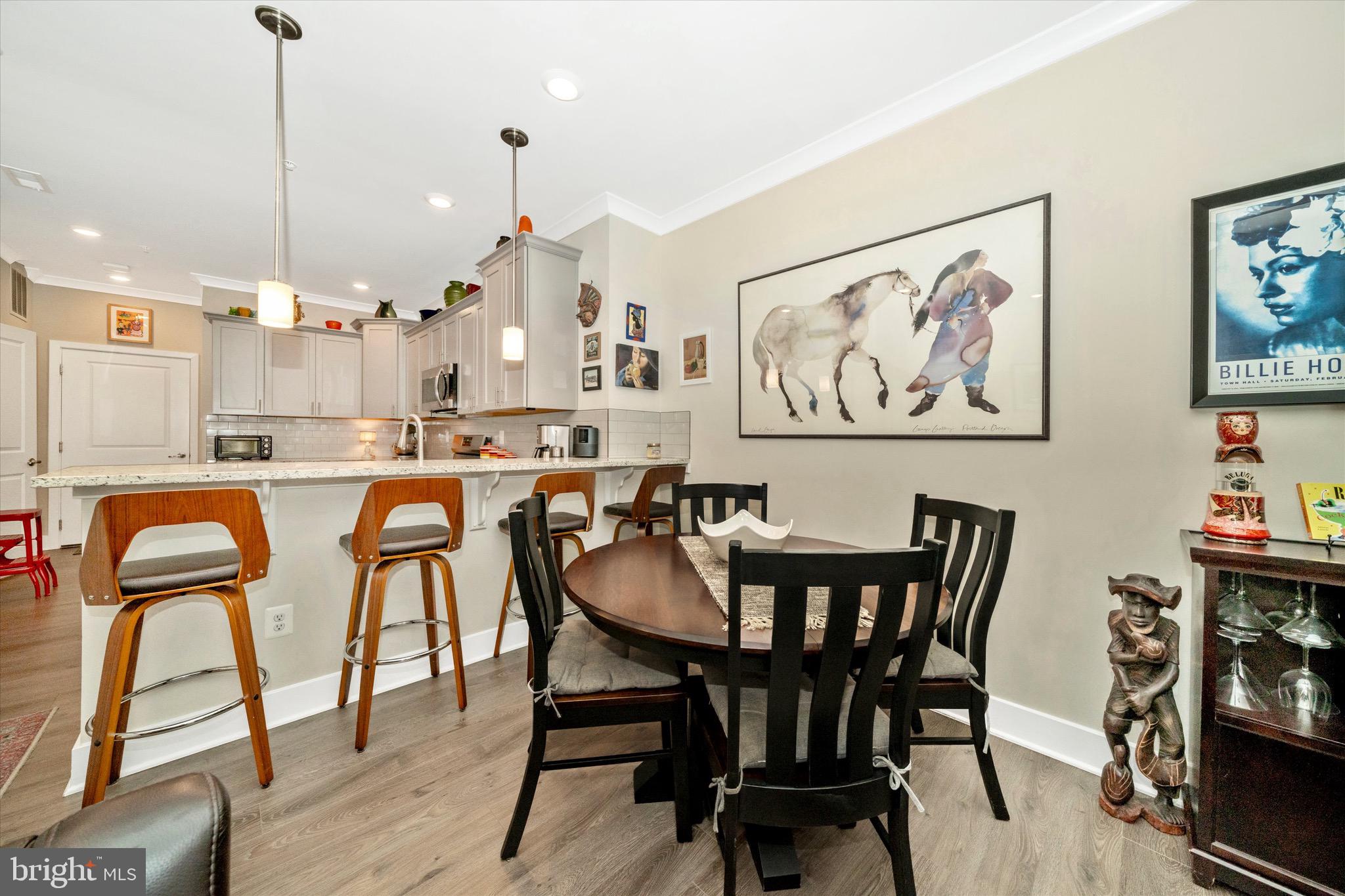 7920 Potter Place, Unit 920B Elkridge, MD 21075 - Photo 13 of 57 a view of a dining room with furniture and wooden floor