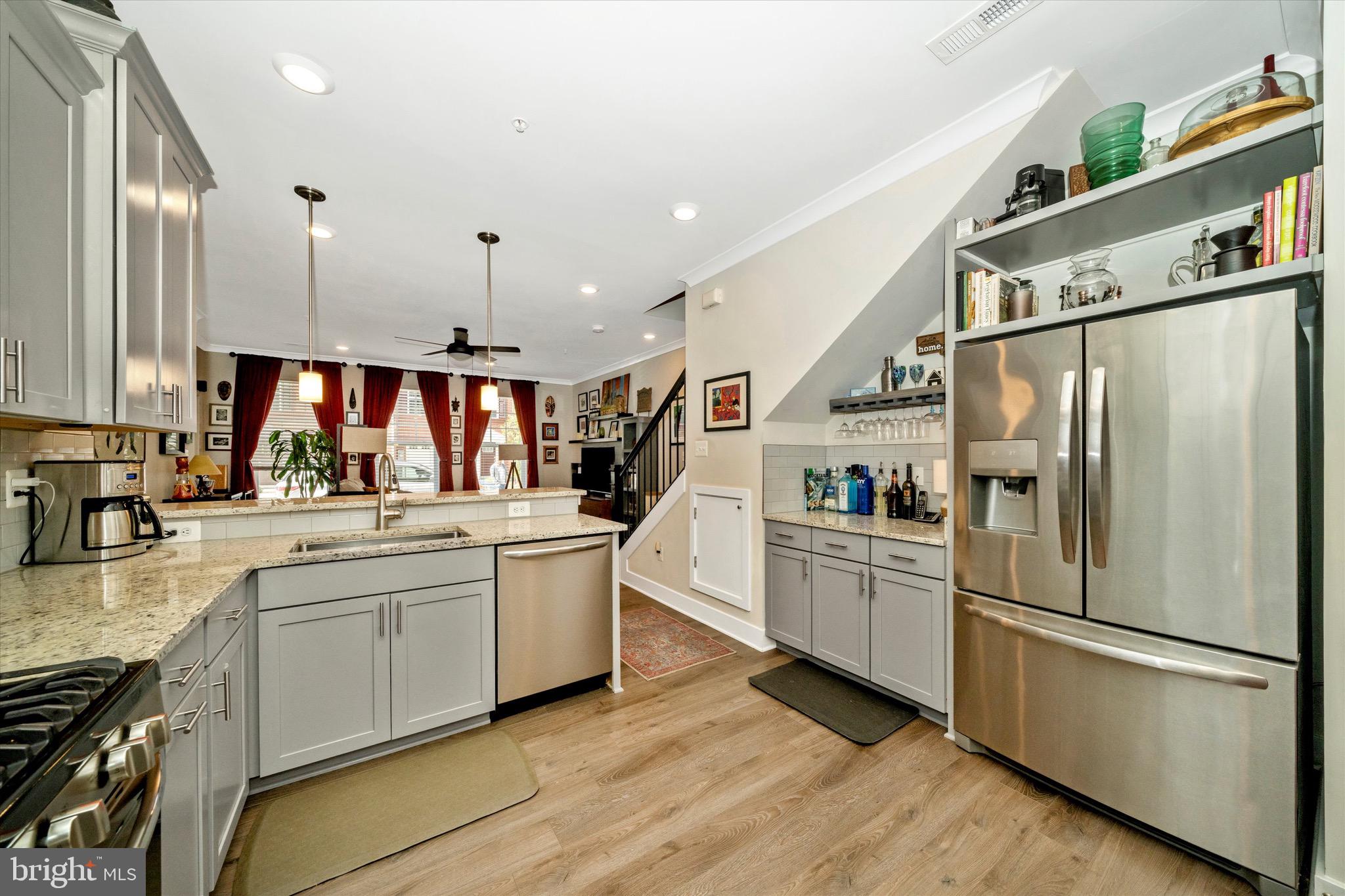 7920 Potter Place, Unit 920B Elkridge, MD 21075 - Photo 19 of 57 a kitchen with white cabinets and stainless steel appliances