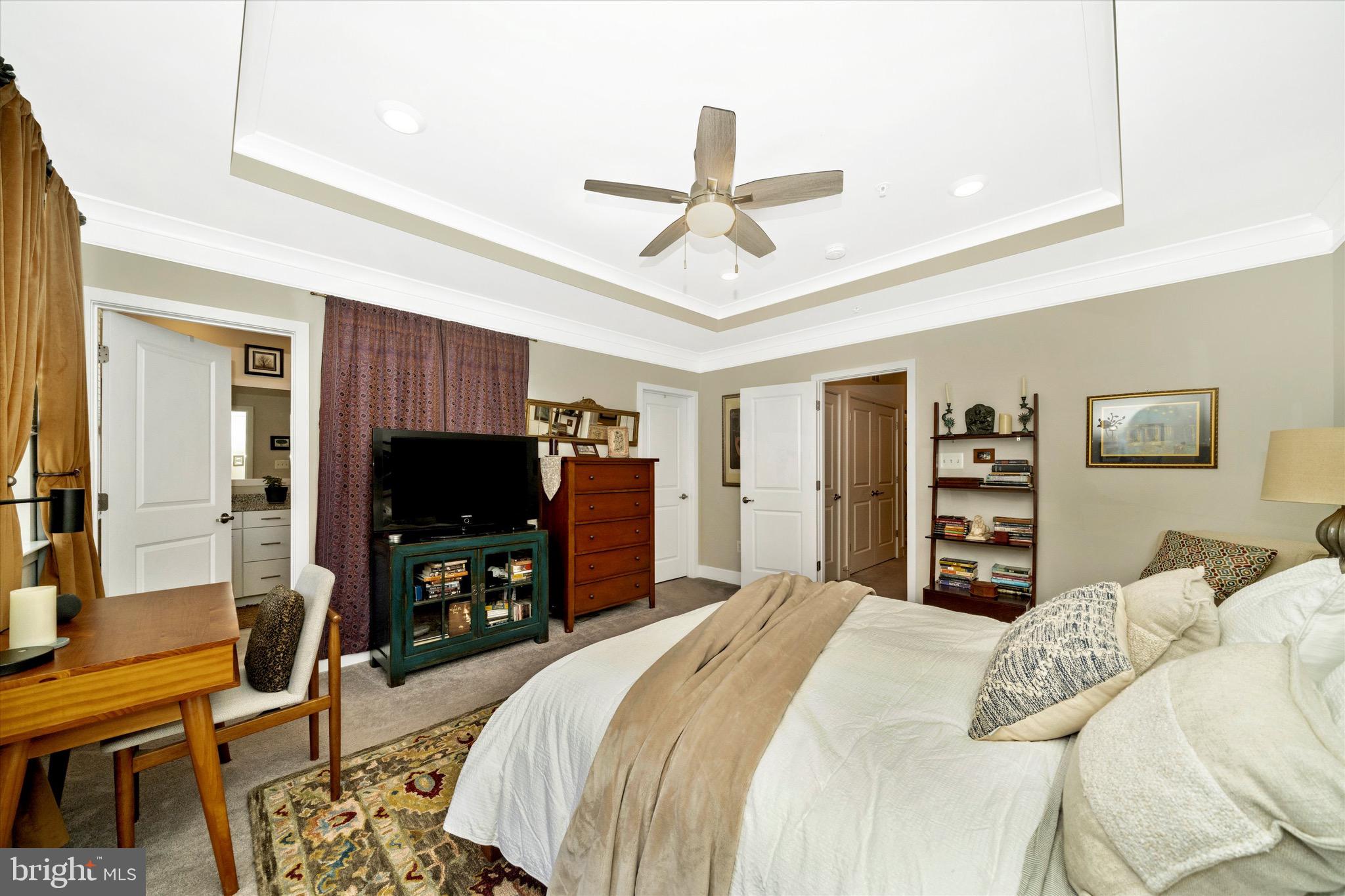 7920 Potter Place, Unit 920B Elkridge, MD 21075 - Photo 28 of 57 a bedroom with a bed and a flat screen tv