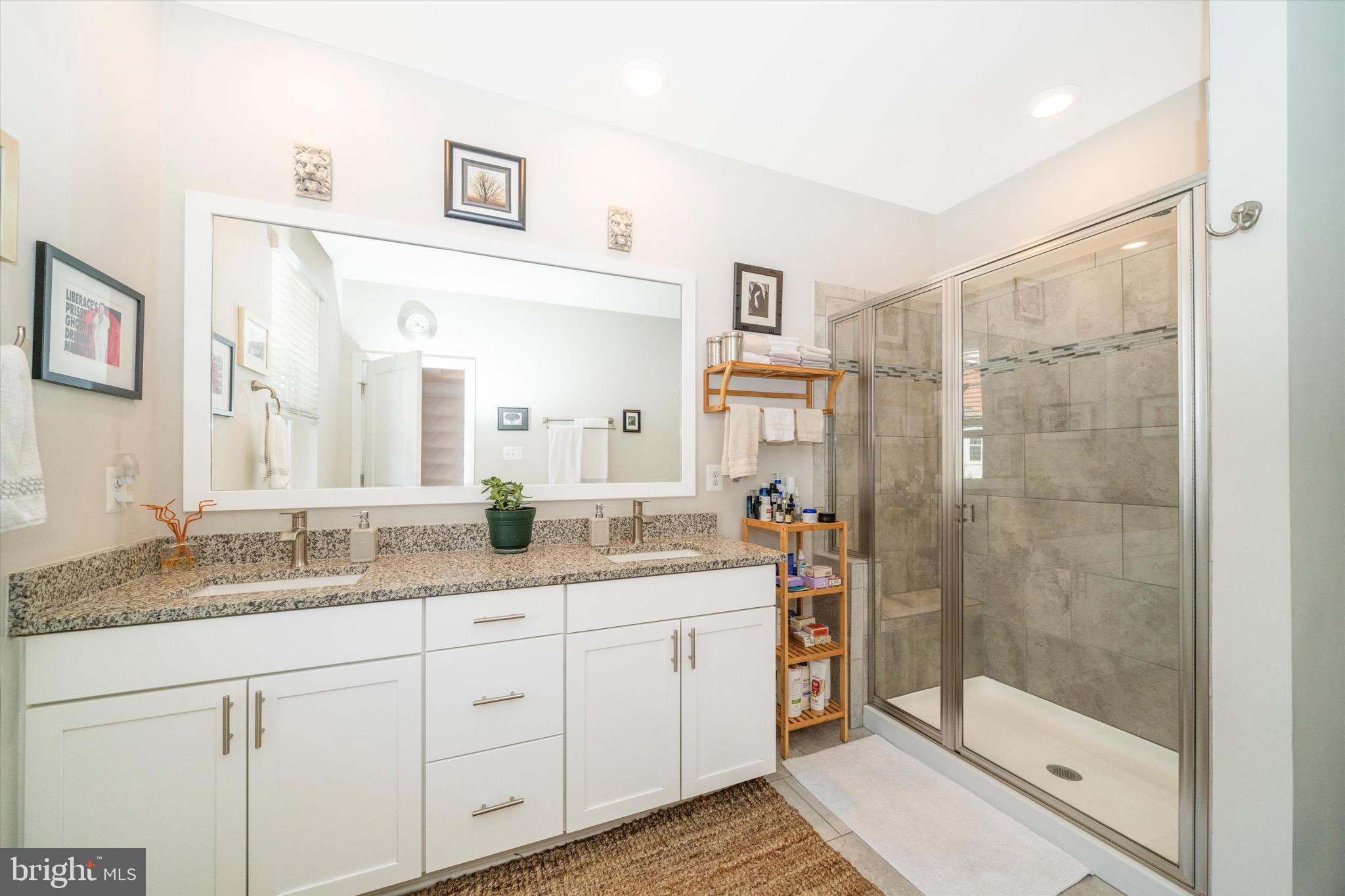 7920 Potter Place, Unit 920B Elkridge, MD 21075 - Photo 30 of 57 a bathroom with a granite countertop sink mirror and shower