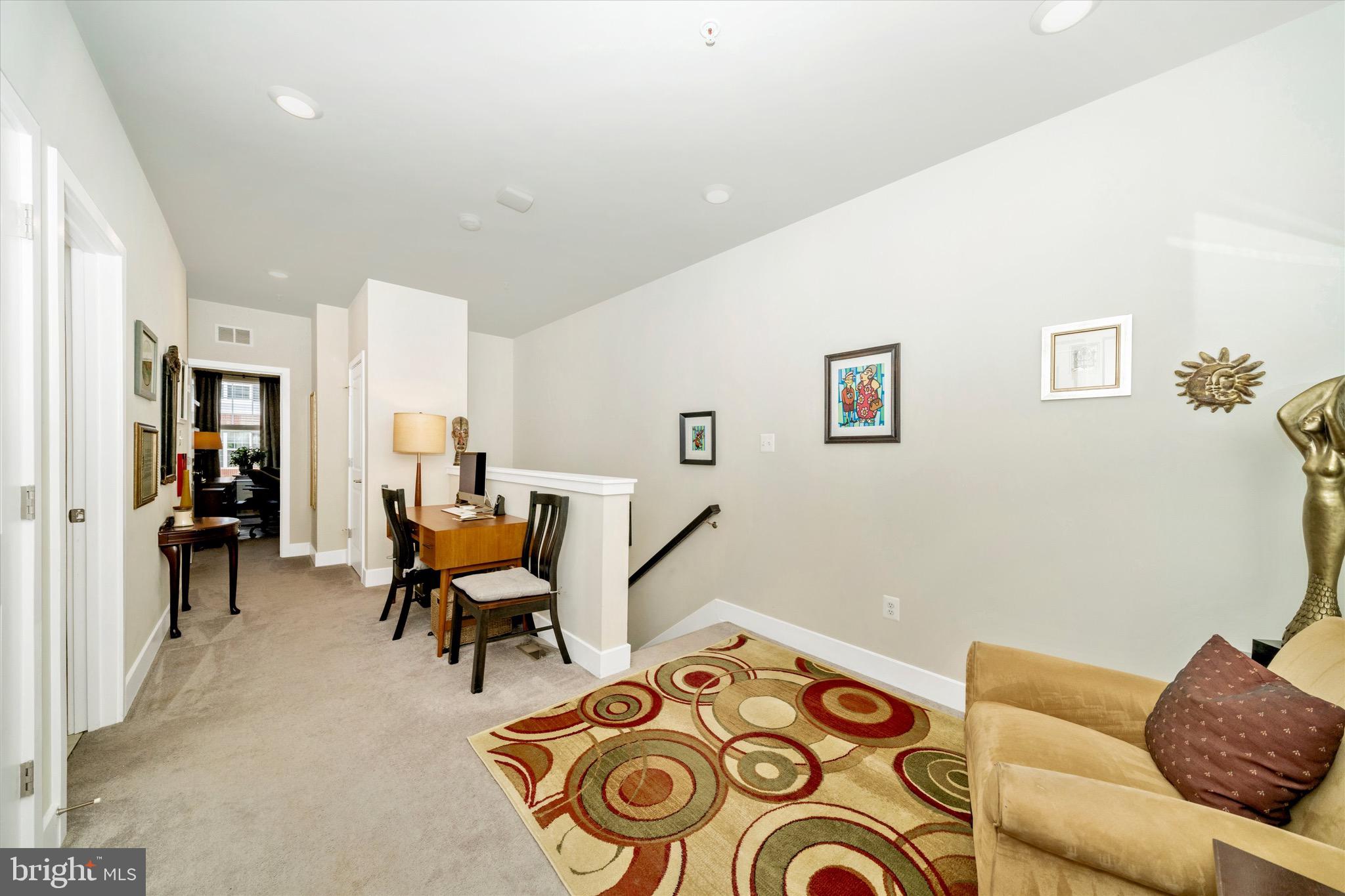 7920 Potter Place, Unit 920B Elkridge, MD 21075 - Photo 32 of 57 a living room with furniture and a wooden floor