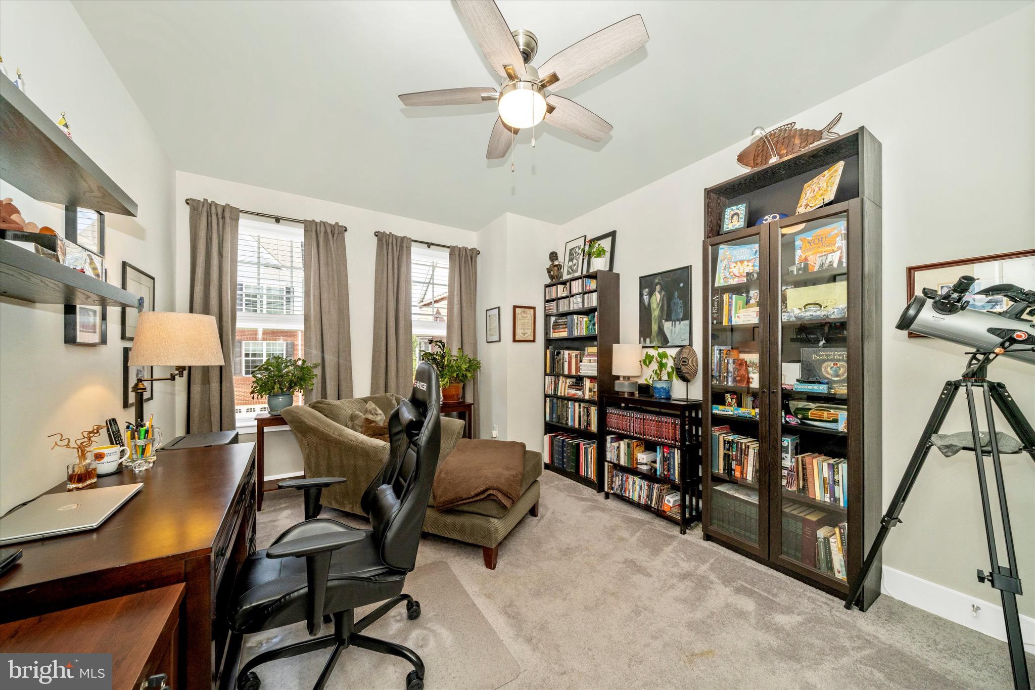 7920 Potter Place, Unit 920B Elkridge, MD 21075 - Photo 34 of 57 a living room with furniture a large window and a chandelier