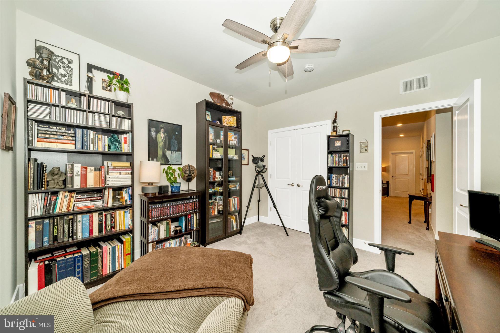 7920 Potter Place, Unit 920B Elkridge, MD 21075 - Photo 37 of 57 a view of a livingroom with furniture and a bookshelf