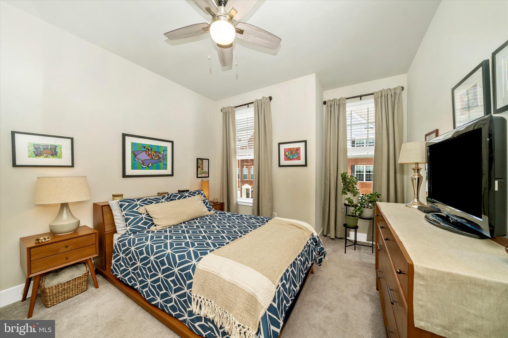 7920 Potter Place, Unit 920B Elkridge, MD 21075 - Photo 38 of 57 a bedroom with bed and a flat screen tv