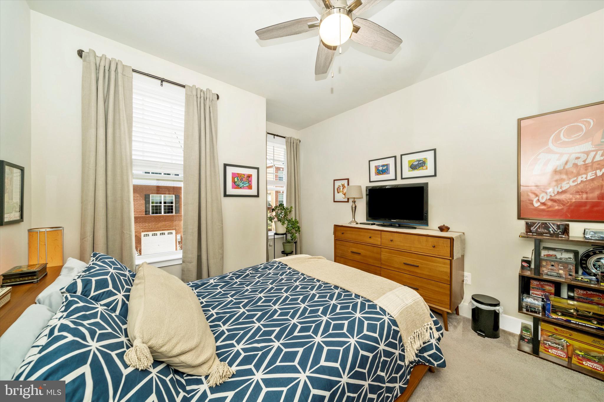 7920 Potter Place, Unit 920B Elkridge, MD 21075 - Photo 39 of 57 a bedroom with a bed and flat screen tv