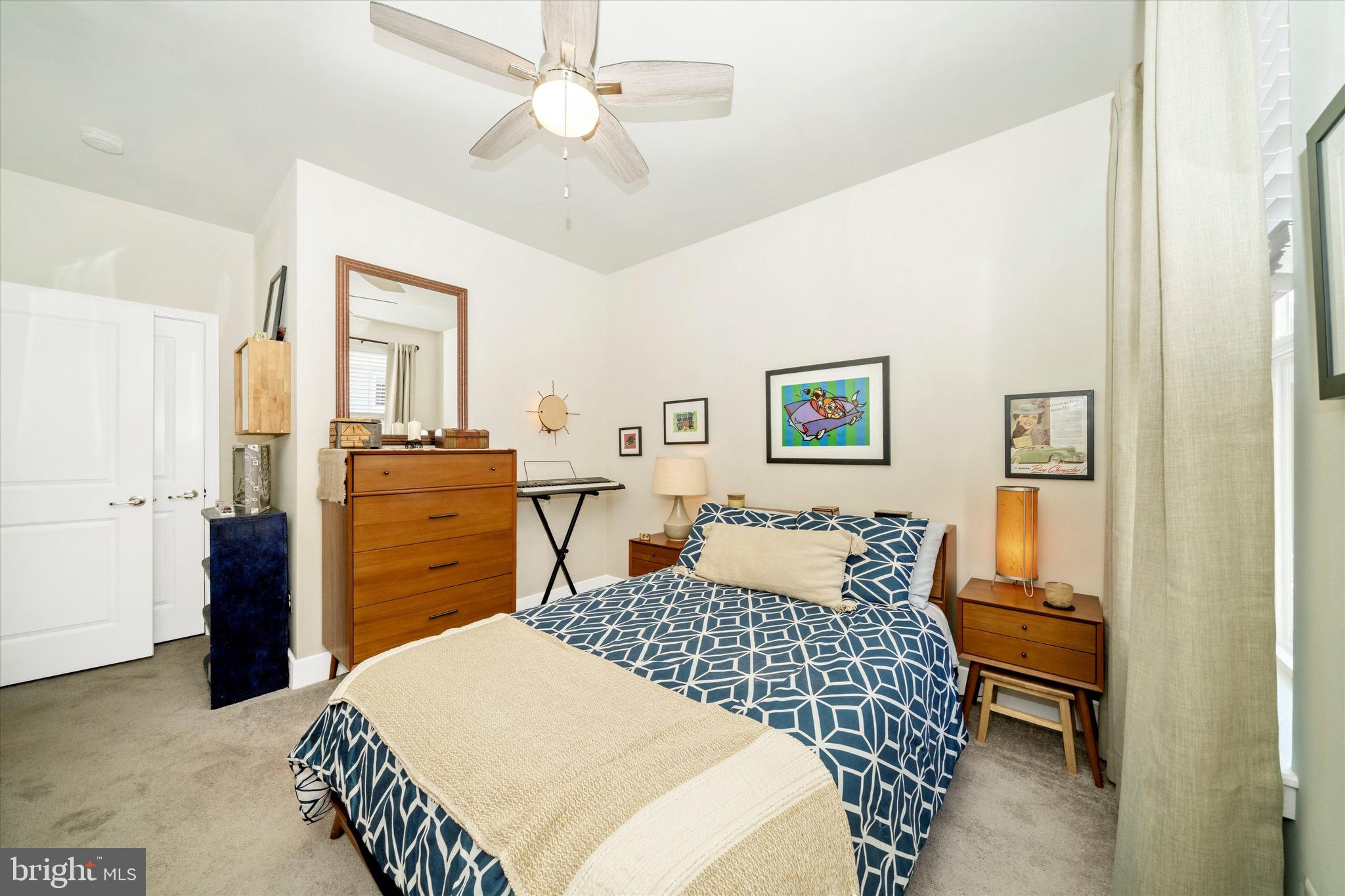 7920 Potter Place, Unit 920B Elkridge, MD 21075 - Photo 40 of 57 a bedroom with a bed and wooden floor