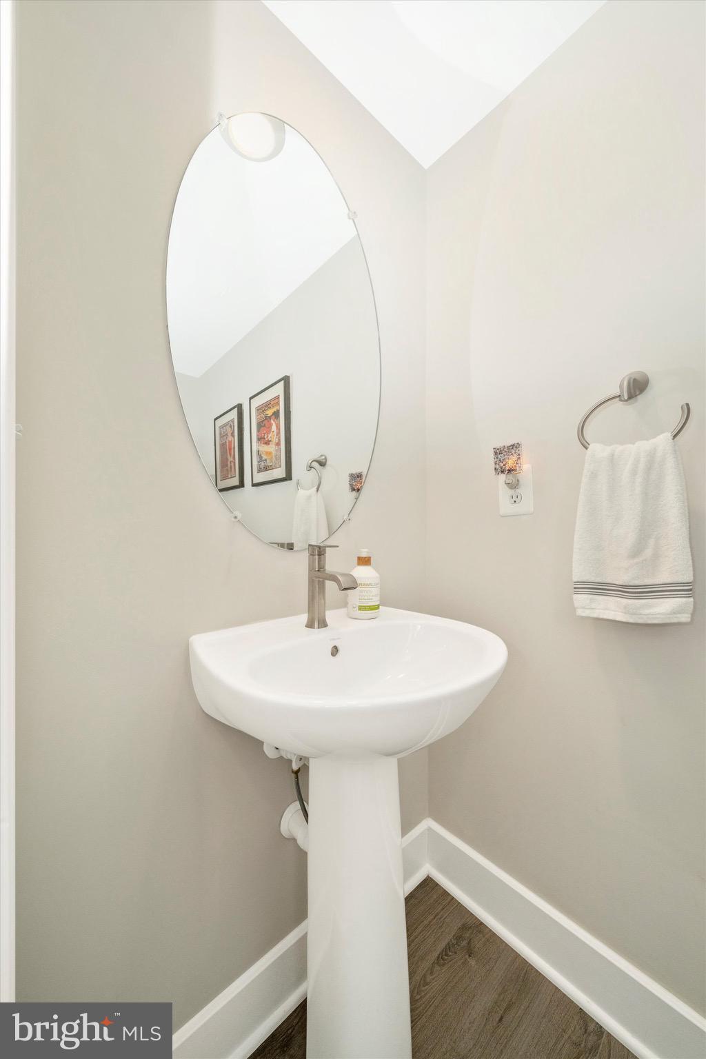 7920 Potter Place, Unit 920B Elkridge, MD 21075 - Photo 44 of 57 a bathroom with a sink a mirror and vanity