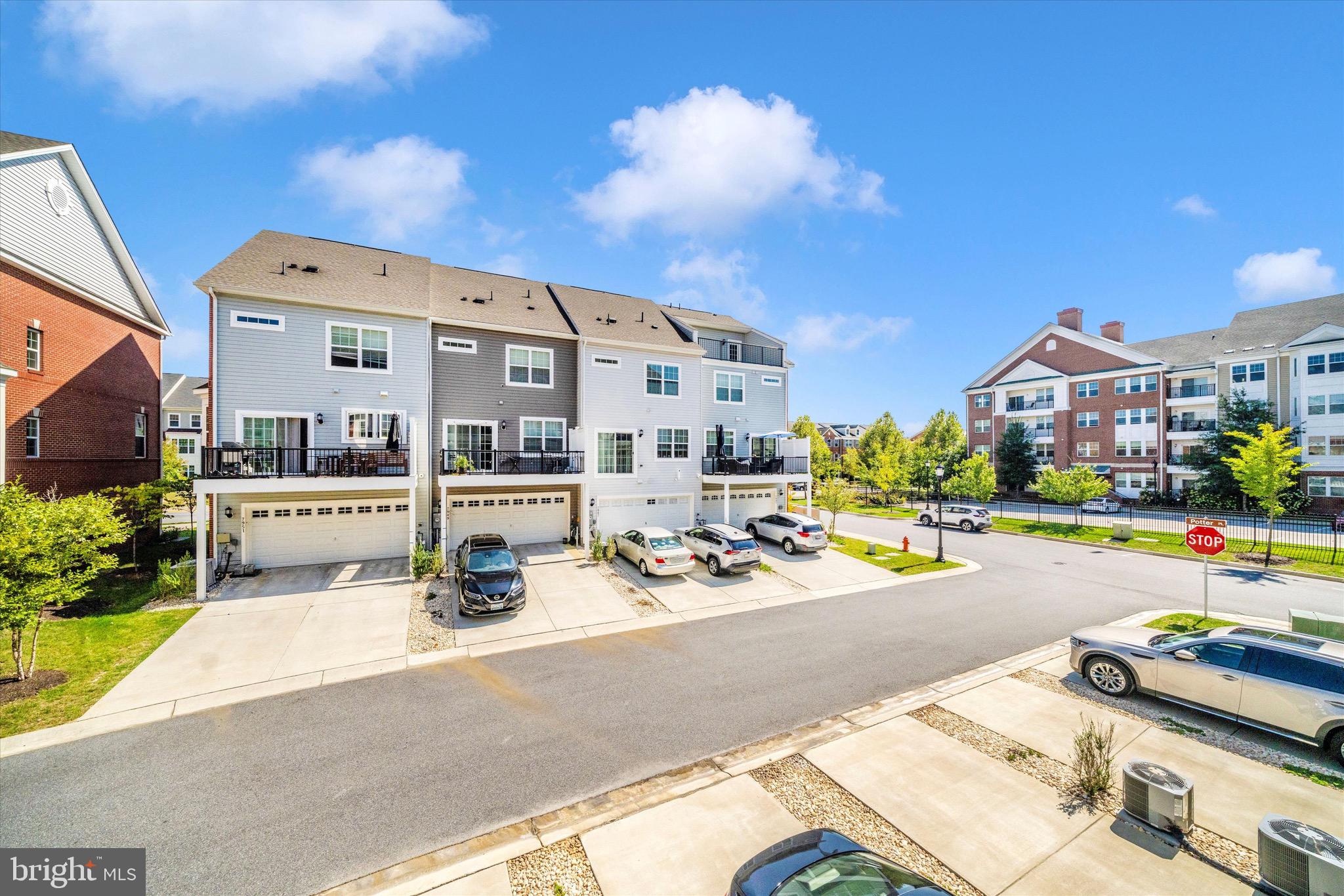 7920 Potter Place, Unit 920B Elkridge, MD 21075 - Photo 50 of 57 a view of building with outdoor space and sitting area