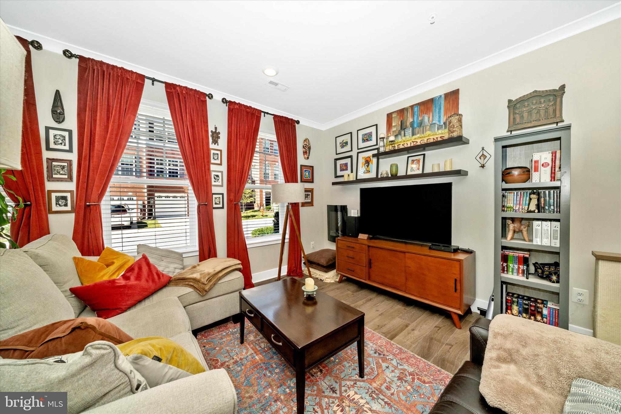 7920 Potter Place, Unit 920B Elkridge, MD 21075 - Photo 9 of 57 a living room with furniture a flat screen tv and a large window