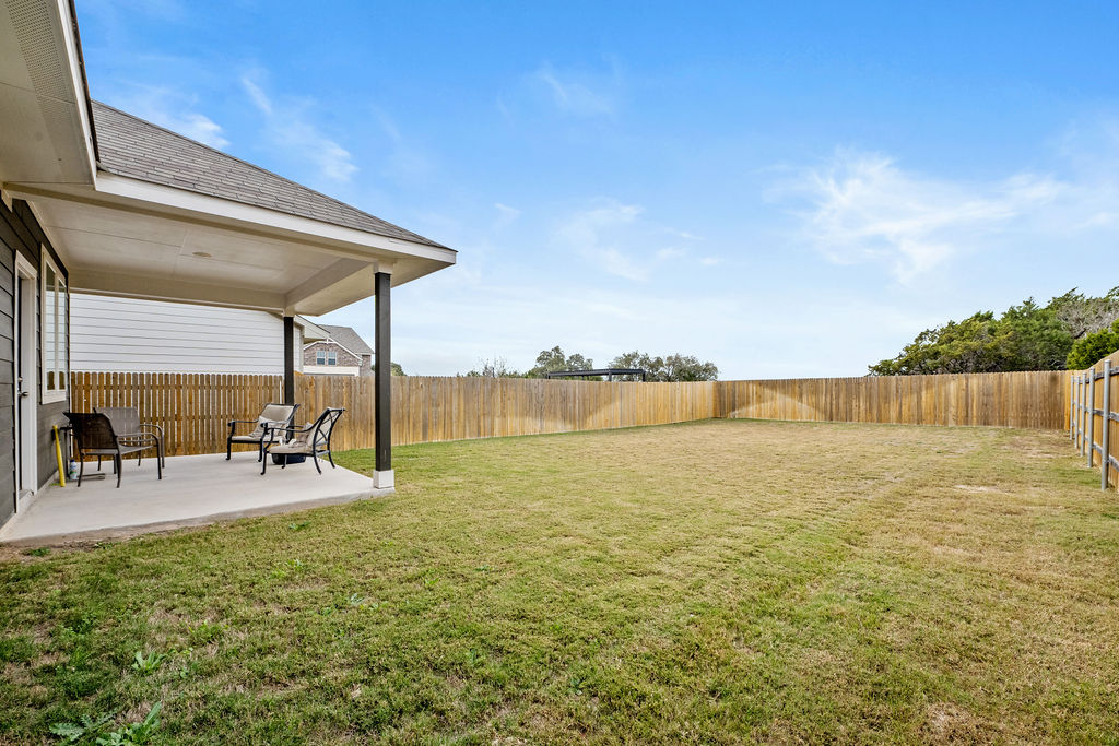 2417 Roosevelt Road Leander, TX 78641 - Photo 40 of 40 Fenced backyard featuring a patio area