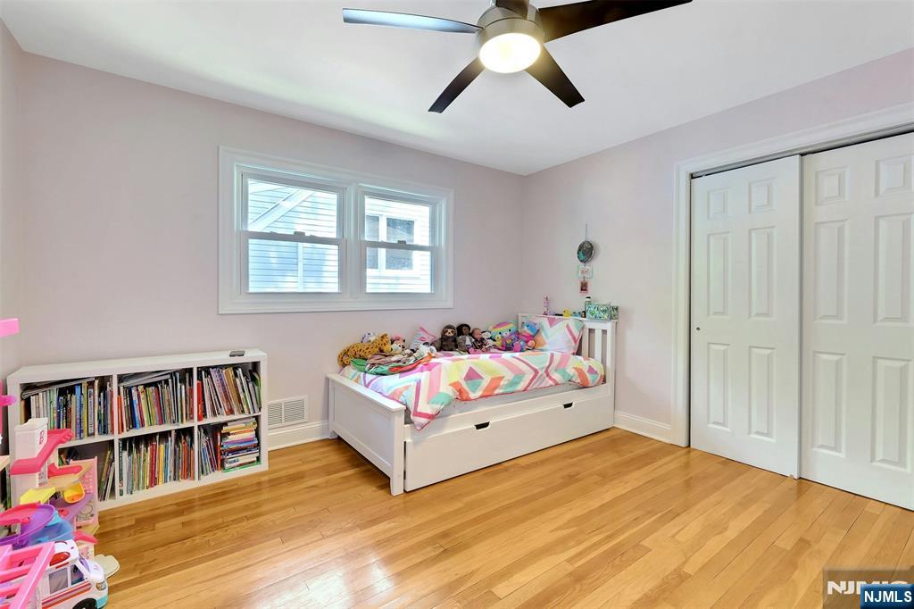 514 Rutland Avenue Teaneck, NJ 07666 - Photo 18 of 40 a bedroom with a bed and closet