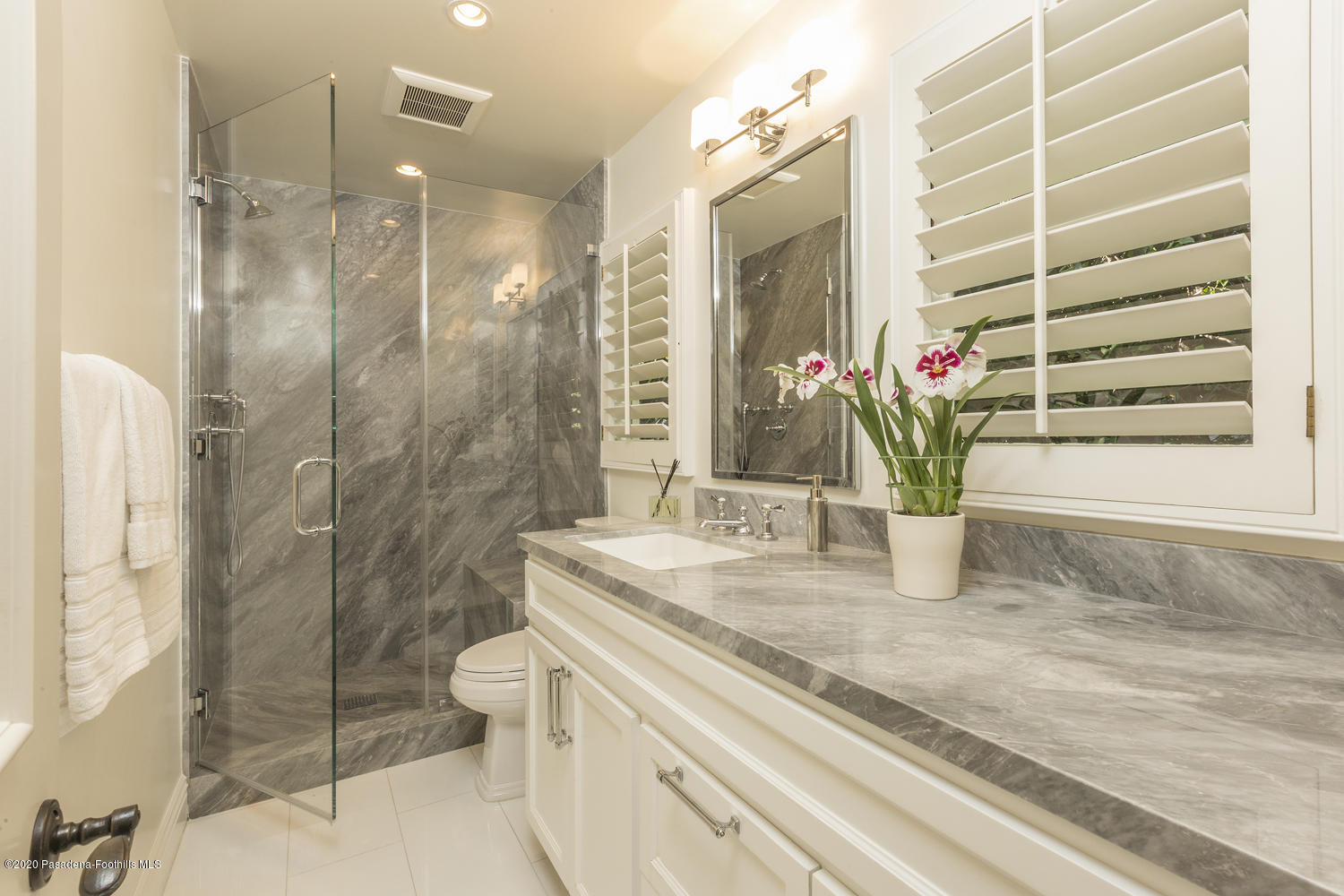 1175 Arden Road Pasadena, CA 91106 - Photo 15 of 30 a bathroom with a granite countertop sink a toilet and shower