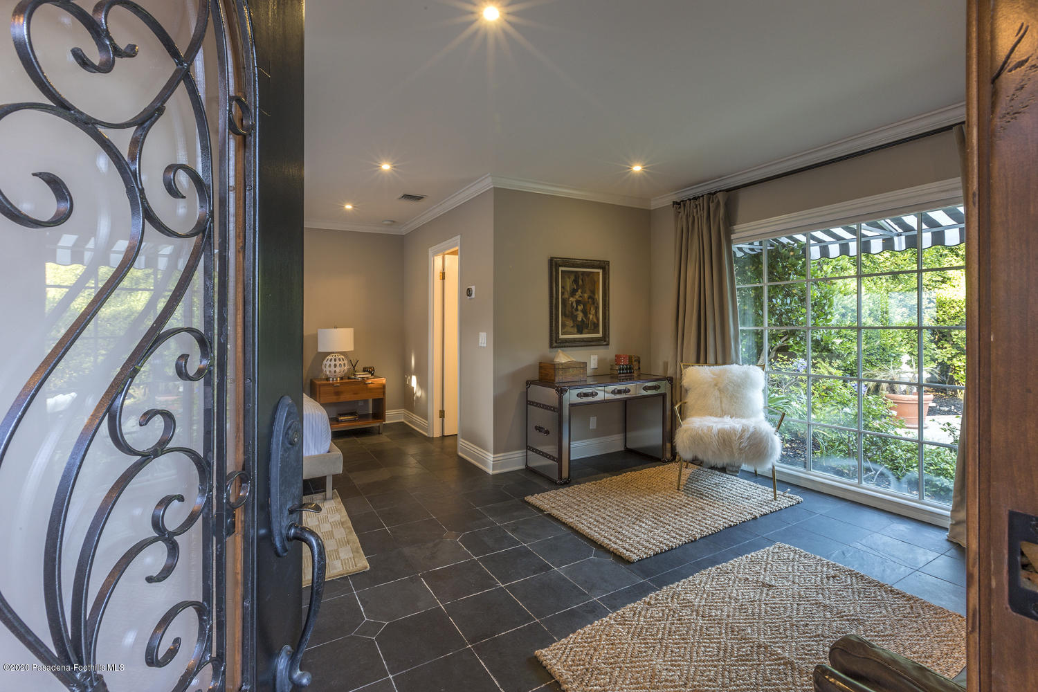 1175 Arden Road Pasadena, CA 91106 - Photo 21 of 30 a living room with furniture a rug and a floor to ceiling window