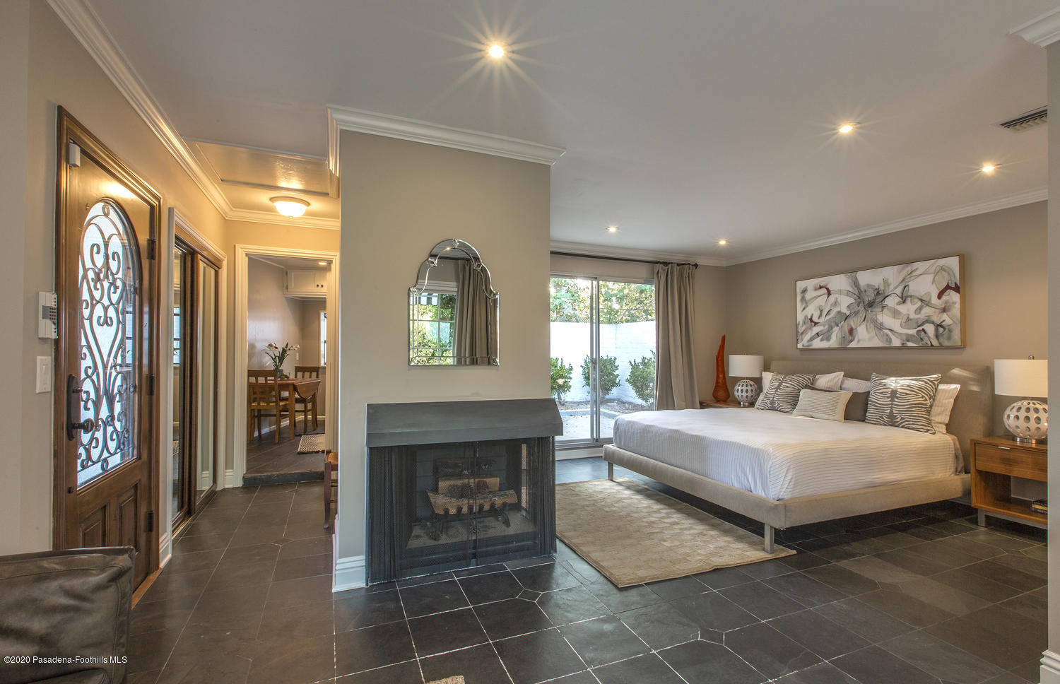 1175 Arden Road Pasadena, CA 91106 - Photo 22 of 30 a spacious bedroom with a bed and a fireplace