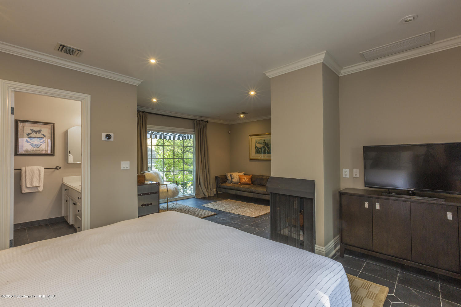 1175 Arden Road Pasadena, CA 91106 - Photo 24 of 30 a bedroom with a bed and a flat screen tv