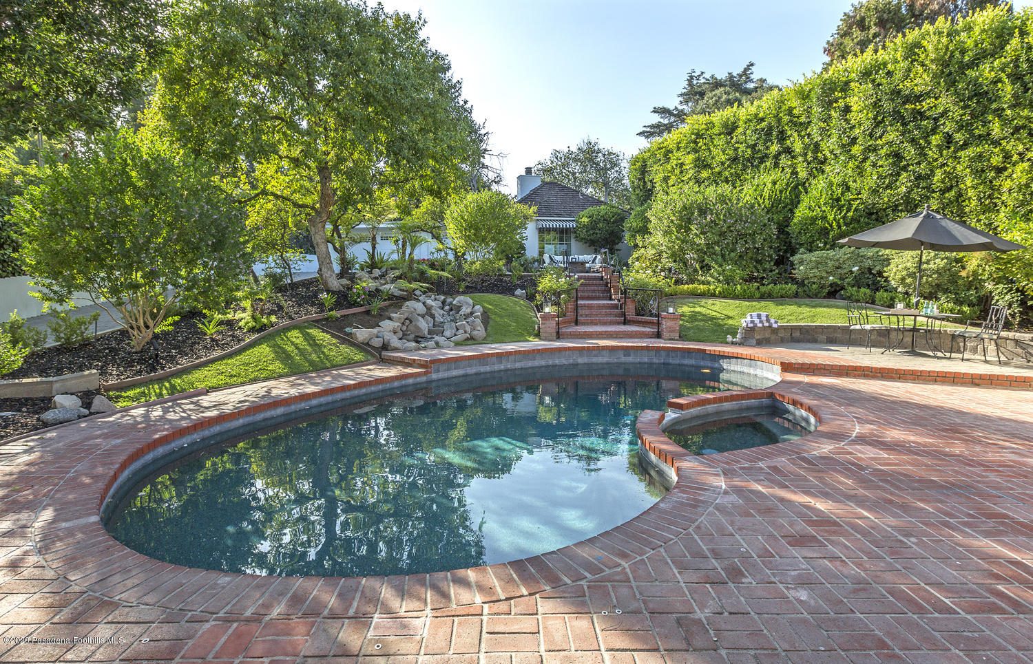 1175 Arden Road Pasadena, CA 91106 - Photo 28 of 30 a view of a swimming pool with a yard and plants
