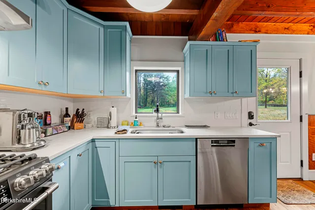 a bedroom with a large bed and a large window