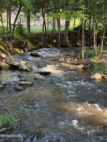 a view of a backyard with green space