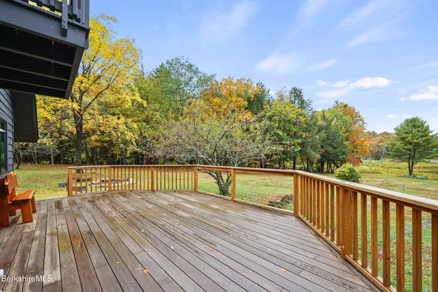 a living room with lots of furniture and a rug
