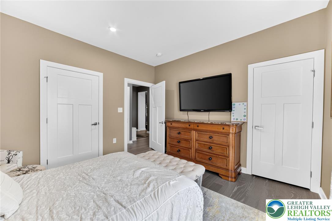 3952 Orth Street Bethlehem, PA 18020 - Photo 20 of 60 Hardwood flooring flows throughout this comfortable and inviting primary bedroom.