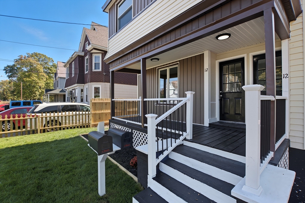 12 St James Avenue Holyoke, MA 01040 - Photo 4 of 42 a view of a house with wooden deck and furniture