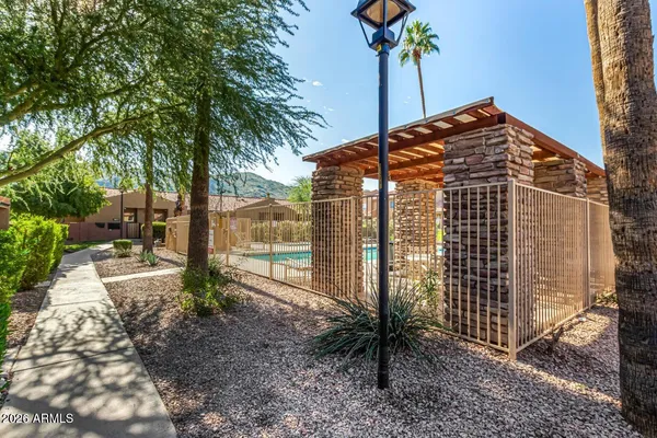 a view of a house with a tree in the background