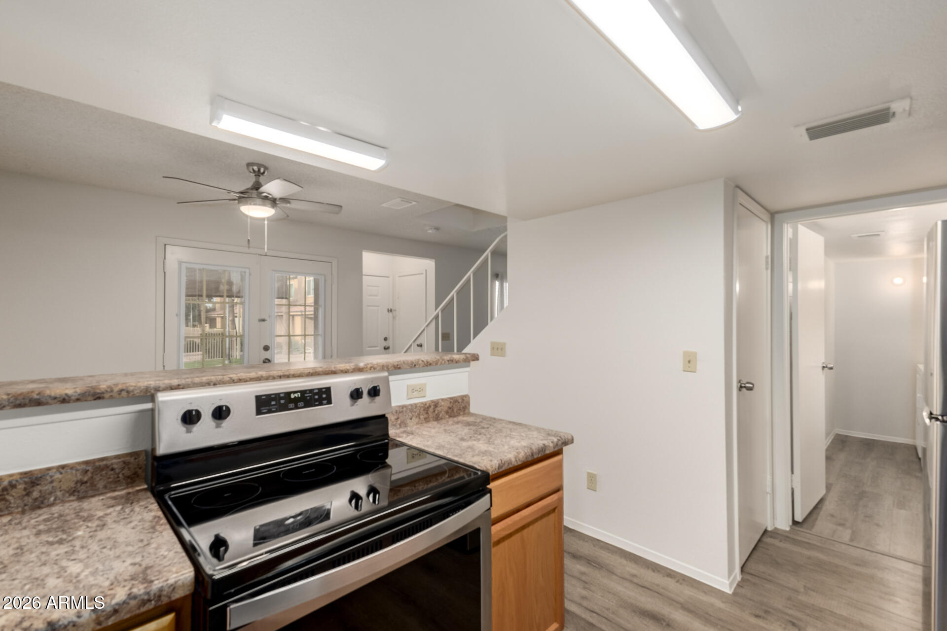 3511 East Baseline Road, Unit 1249 Phoenix, AZ 85042 - Photo 8 of 29 Kitchen/ Half Bath/ Laundry Room