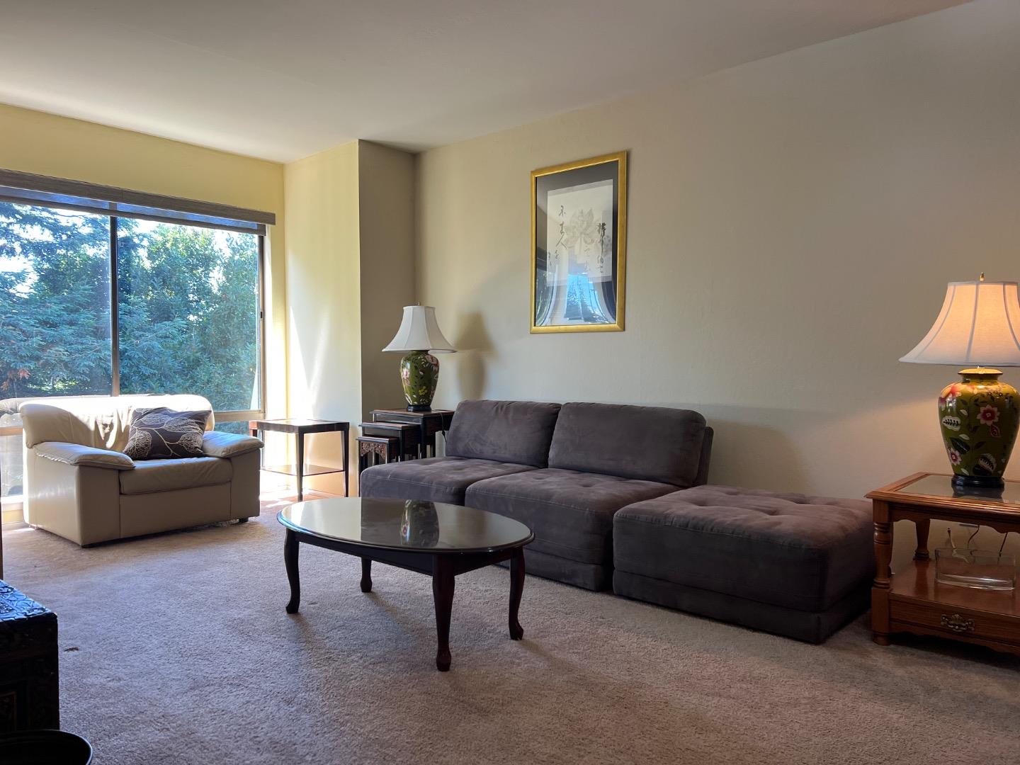 426 Arkansas Street, Unit 2 San Francisco, CA 94107 - Photo 1 of 13 a living room with furniture and a large window