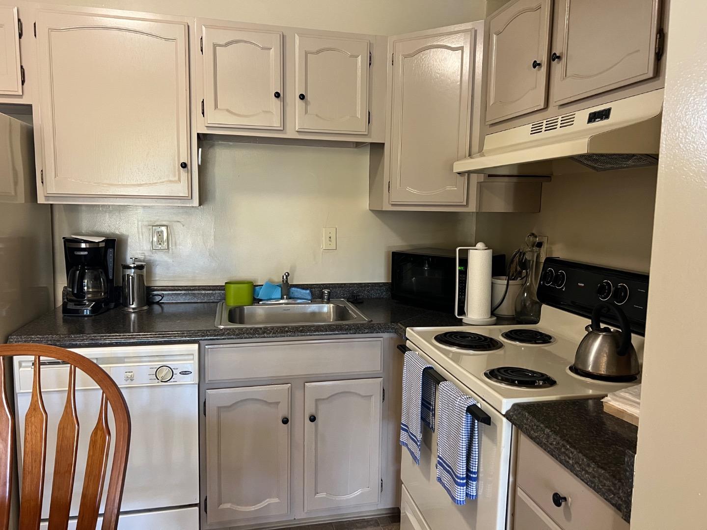 426 Arkansas Street, Unit 2 San Francisco, CA 94107 - Photo 5 of 13 a kitchen with stainless steel appliances granite countertop a stove a sink and a white cabinets