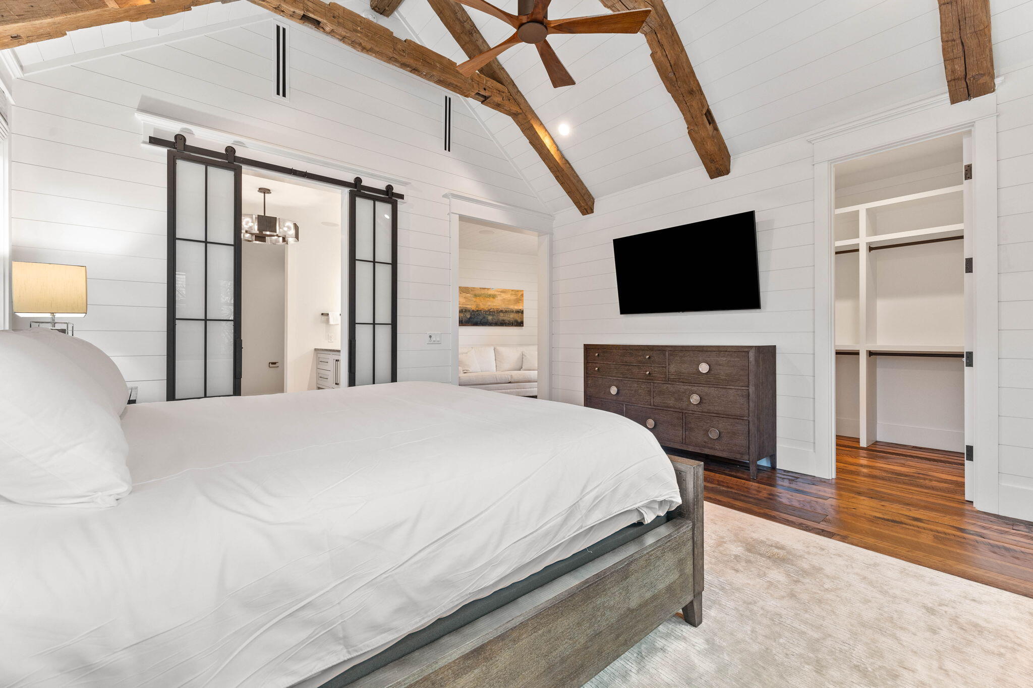 58 Coopersmith Ln Inlet Beach Inlet Beach, FL 32461 - Photo 71 of 130 a bedroom with a bed a flat screen tv and a fireplace with the outer view