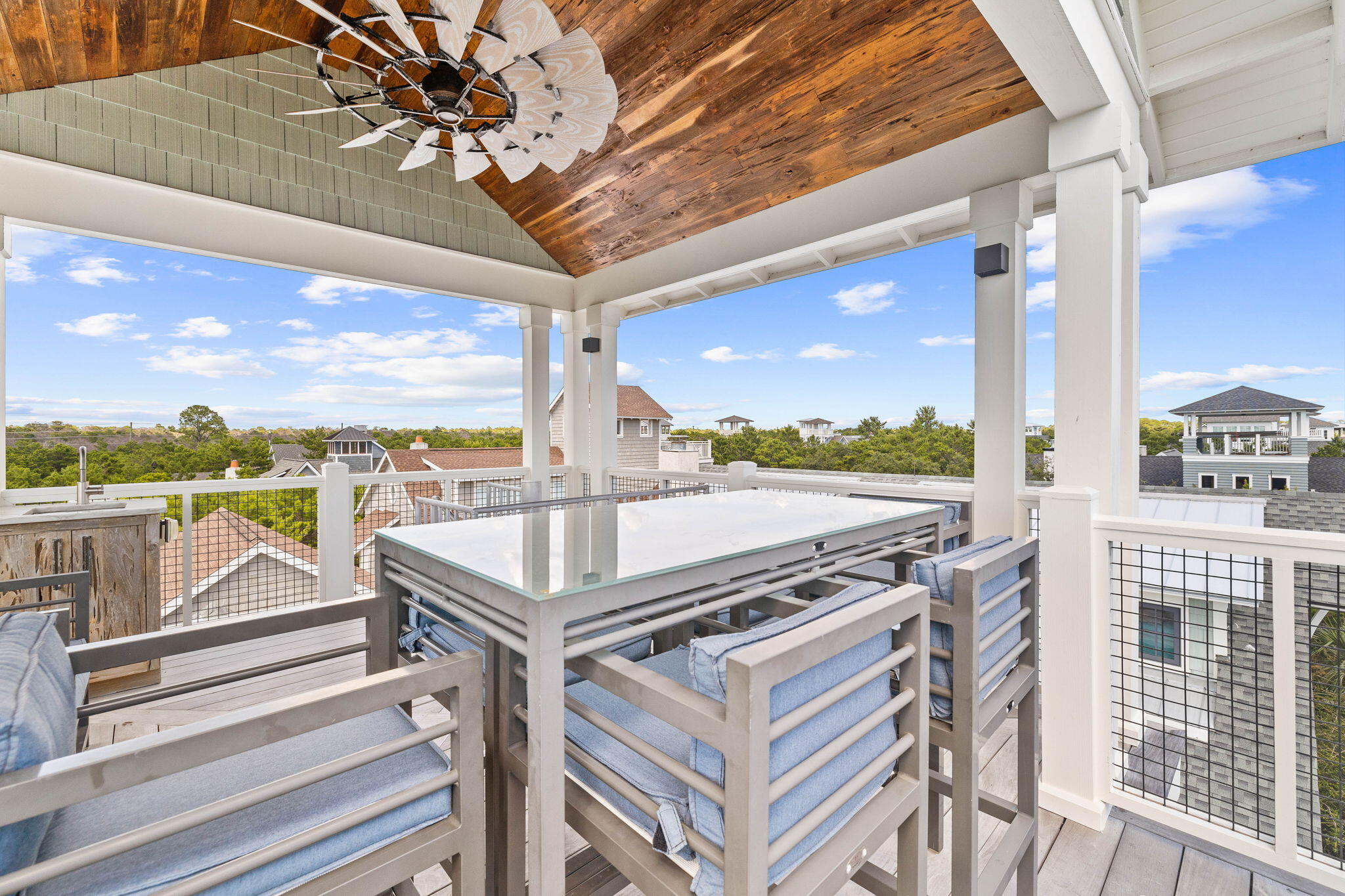 58 Coopersmith Ln Inlet Beach Inlet Beach, FL 32461 - Photo 91 of 130 a view of a balcony with furniture and floor to ceiling window