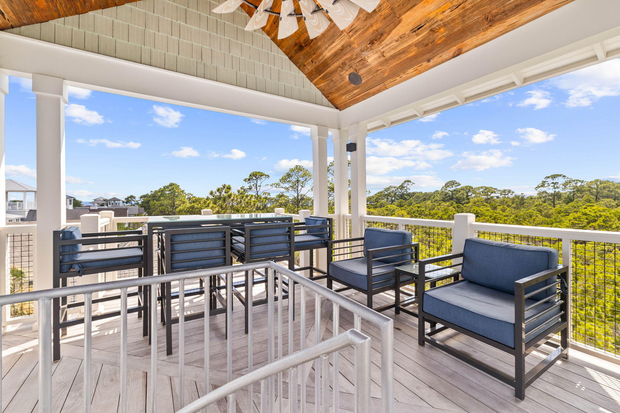 58 Coopersmith Ln Inlet Beach Inlet Beach, FL 32461 - Photo 93 of 130 a roof deck with outdoor seating and city view