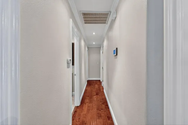 a view of a hallway with a door