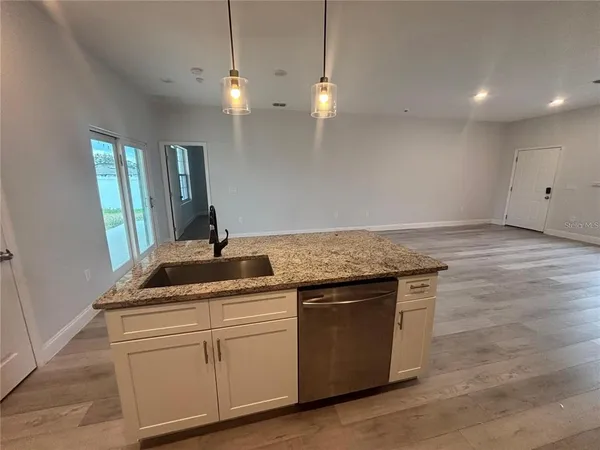 a kitchen with a sink and cabinets