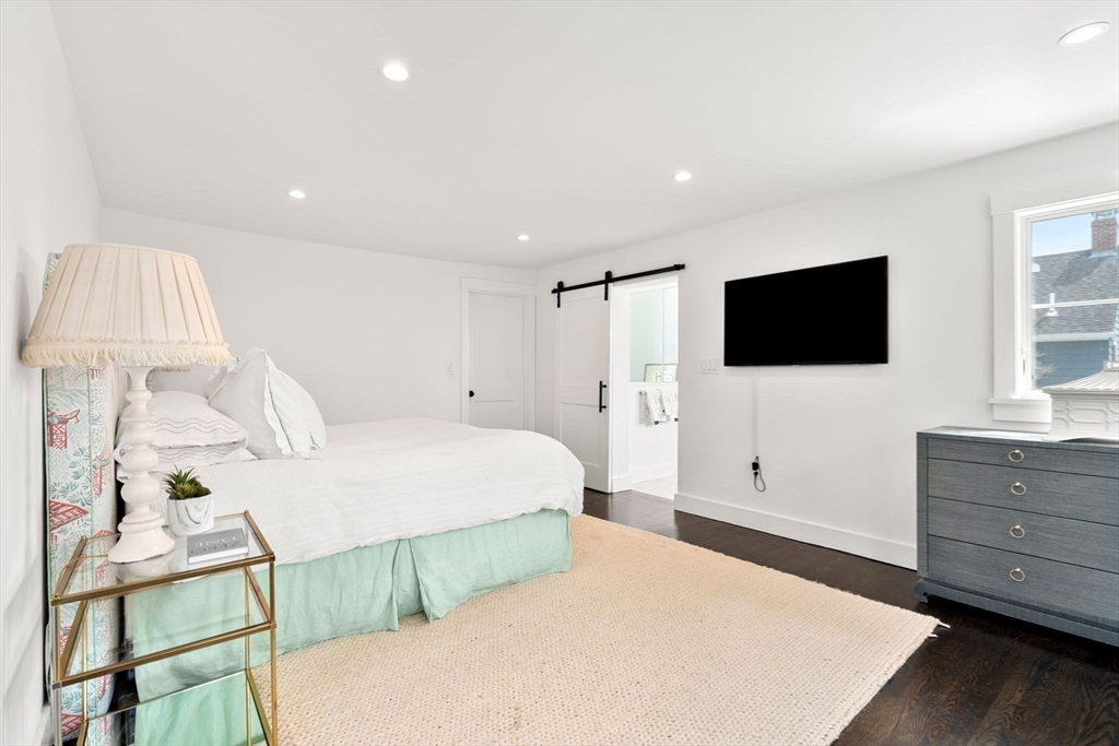 28 Rose Avenue Marblehead, MA 01945 - Photo 16 of 31 a bedroom with a bed and a flat screen tv