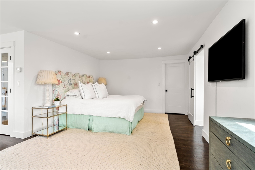 28 Rose Avenue Marblehead, MA 01945 - Photo 17 of 31 a bedroom with a bed and a flat screen tv