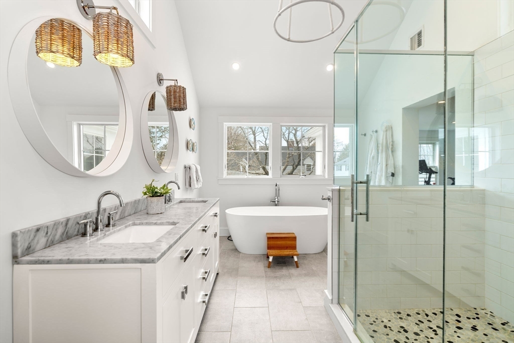28 Rose Avenue Marblehead, MA 01945 - Photo 19 of 31 a bathroom with a granite countertop sink mirror and bathtub