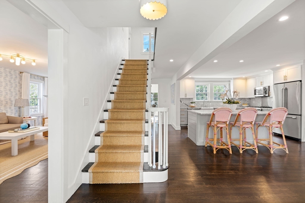 28 Rose Avenue Marblehead, MA 01945 - Photo 2 of 31 a room with lots of white furniture and wooden floor